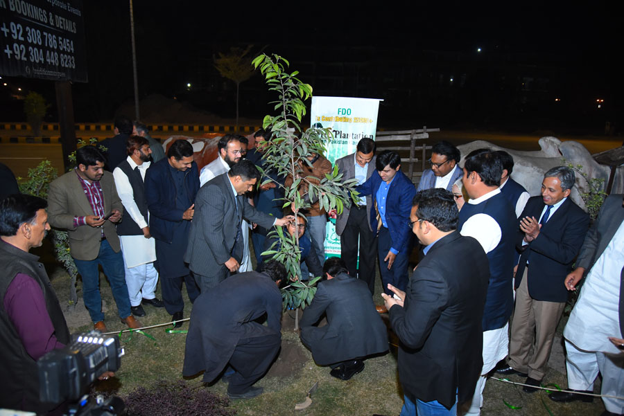 FDO Board of Directors and other stakeholders are planting a tree.JPG
